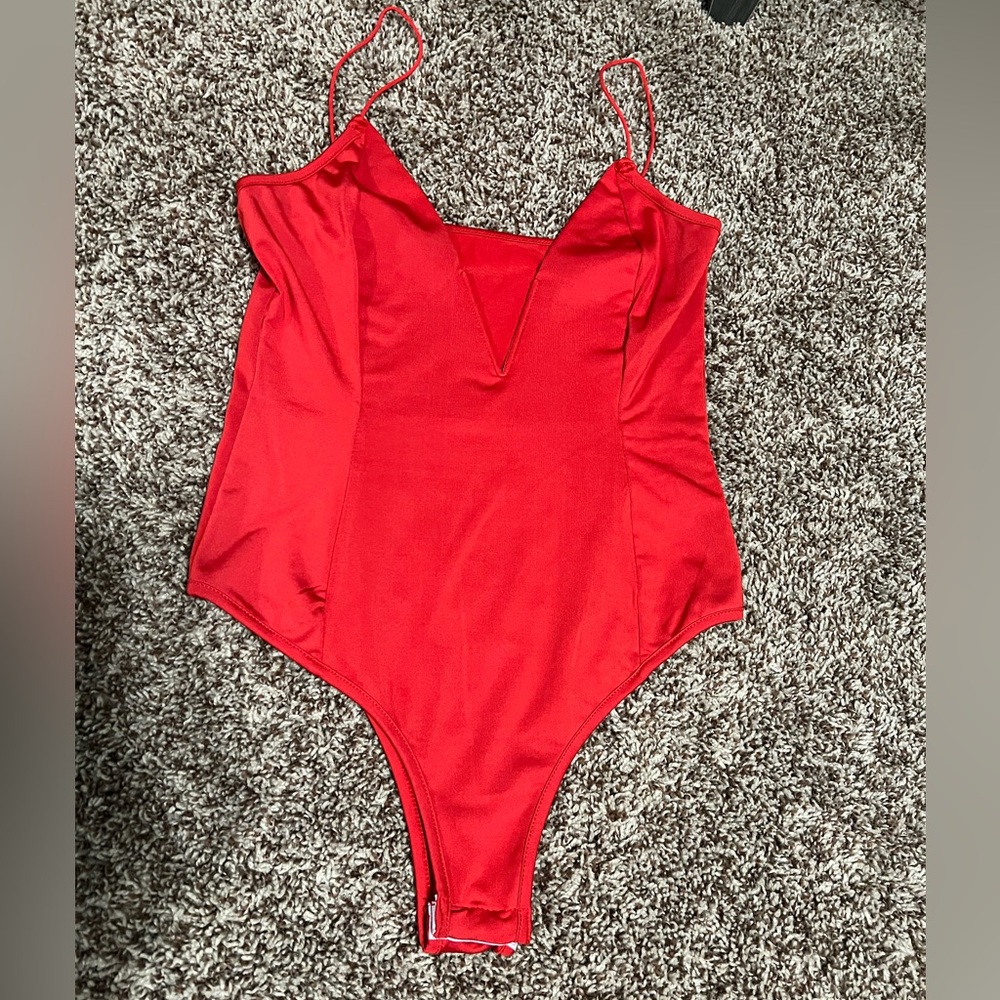 Small, petite bright red low V onesie